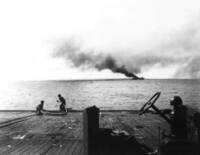 Photograph of Another Ship Taken from the Flight Deck of the USS Kalinin Bay during the Battle of Samar
