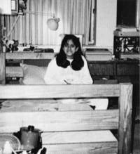 Student relaxes in her dormitory room