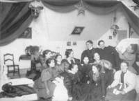 Female students gather together in a bedroom