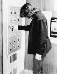 Student unlocks his dormitory mailbox
