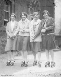 Four female students on rollerskates