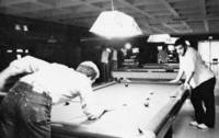 Students enjoy a game of pool
