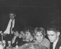 Students gather together at a table