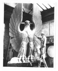 Sculptor working on eagle